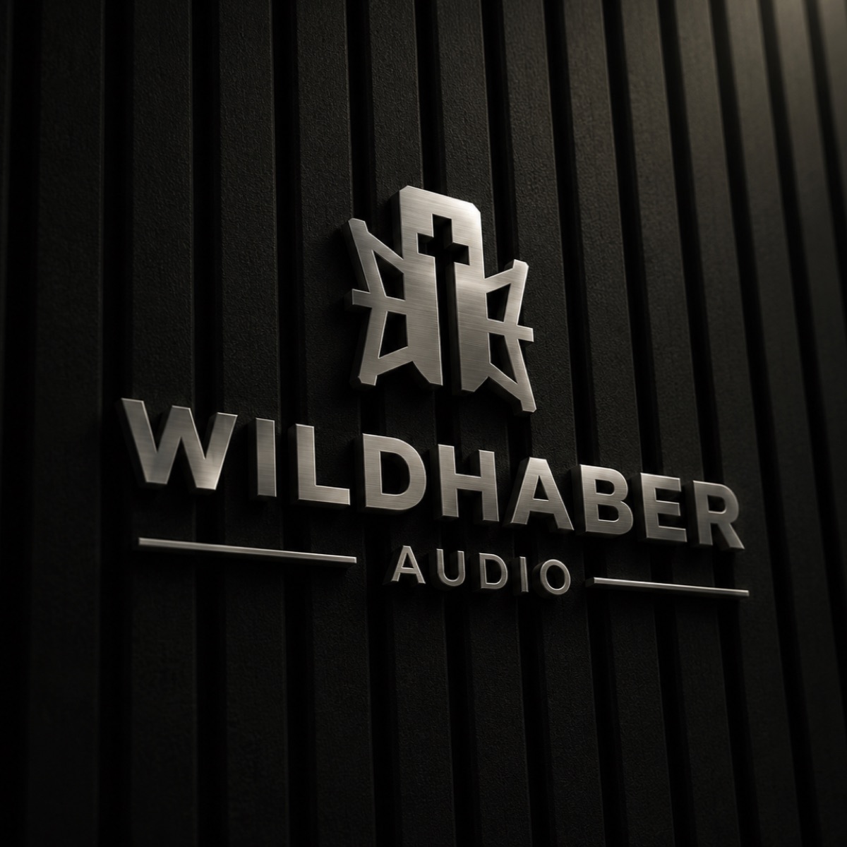 Wildhaber Audio metal logo mounted on a wood panel wall